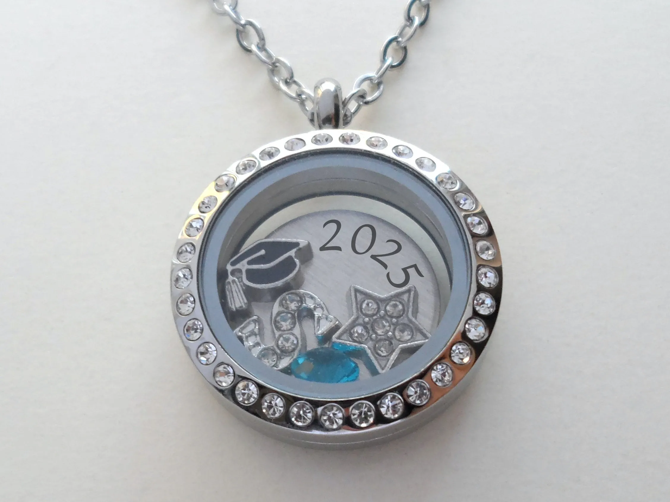 Class of 2025 Graduate Locket Necklace with Graduate Cap, 2025 Disc, and Custom Letter & Birthstone - by Jewelry Everyday
